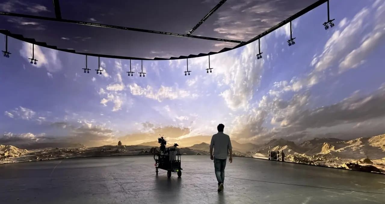 Man walking on a stage in the mountains